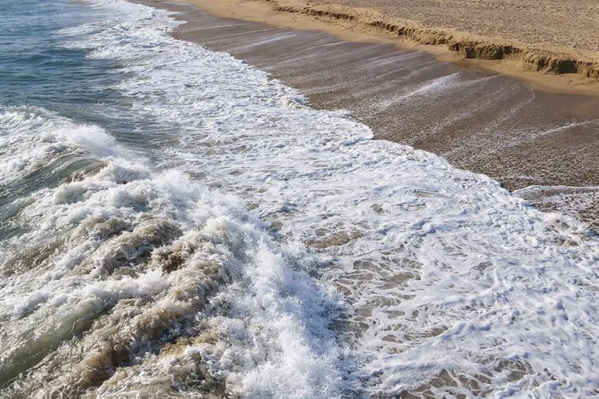 Decades-Old Relics Resurface at Newport Beach's Wedge Due to Erosion